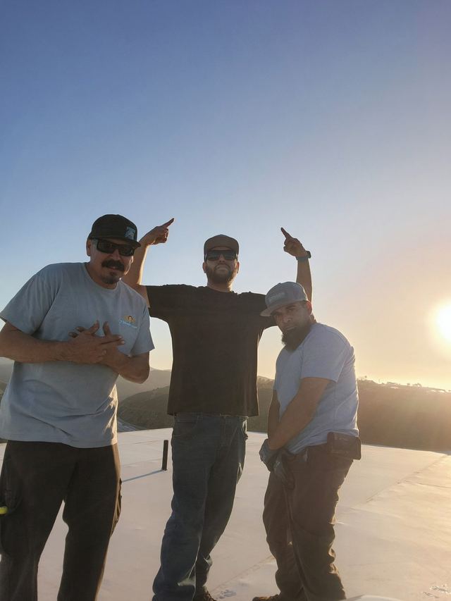 75 Degree Heating & Air crew on a rooftop job in San Diego at sunset